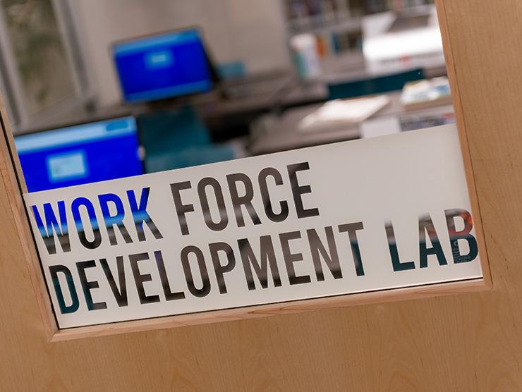 photo of frosted glass door with "work force development lab" written in bold letters